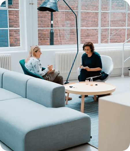 Two people in a casual meeting